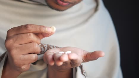 man taking medication