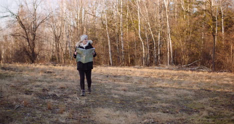 Tourist-Reading-Map-On-Trail-In-Mountains-10