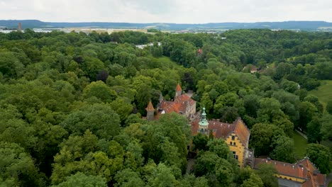 4k aerial drone video of the evangelische tagungsstätte church and reichsstadthalle event venue in rothenburg, germany