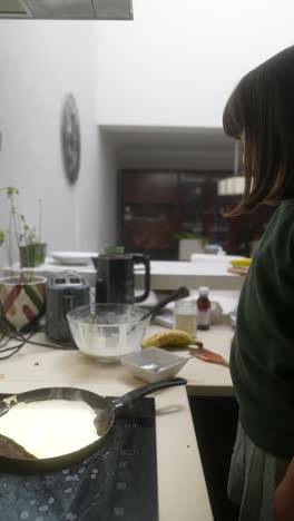 girl cooking pancakes
