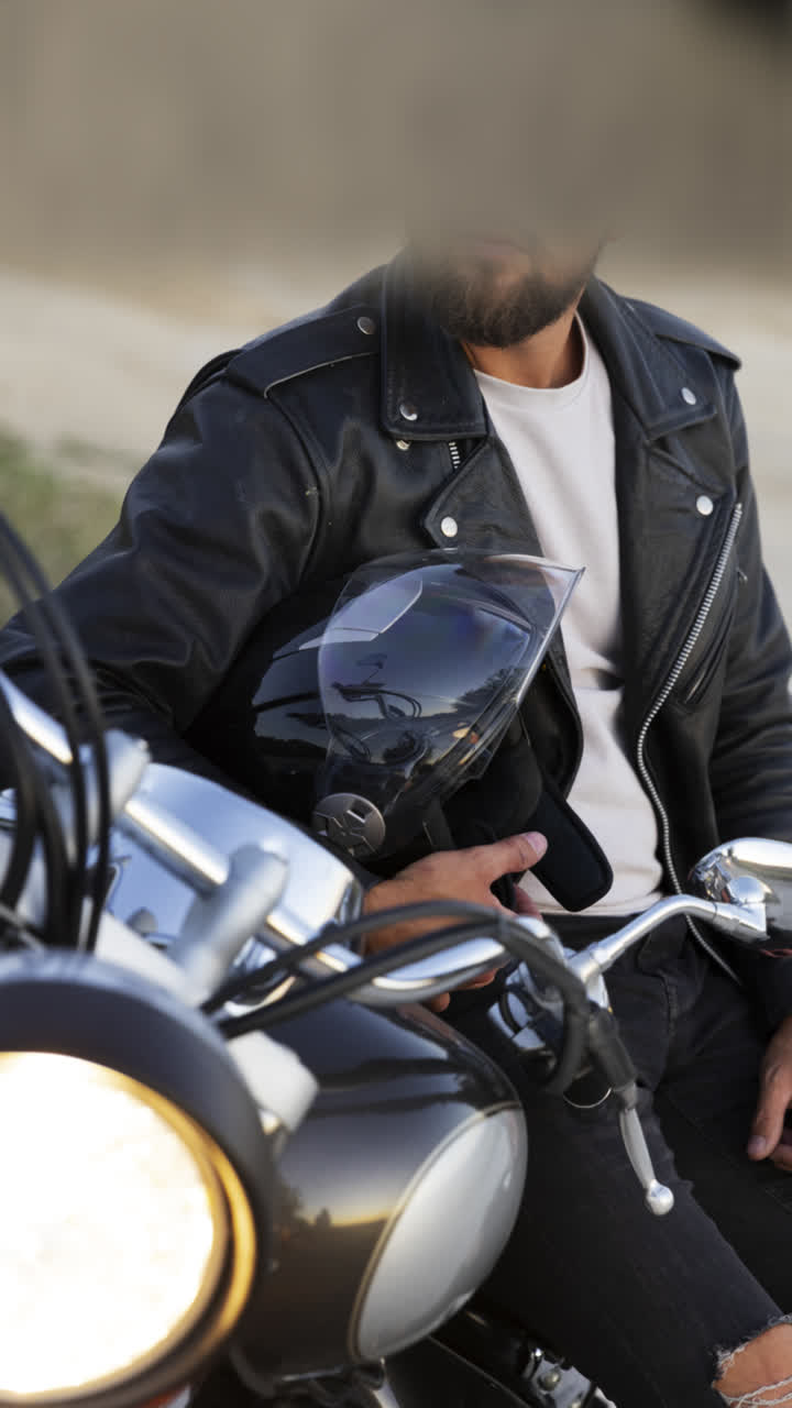 Man Riding and Posing with a Motorcycle