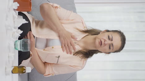 vertical video of sick woman with rapid breathing. the woman cannot control her breathing.