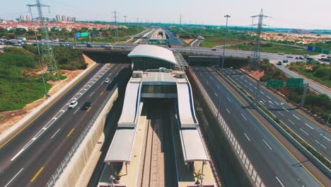 Aerial-of-car-traffic-on-the-highways-on-both-sides-of-the-frame