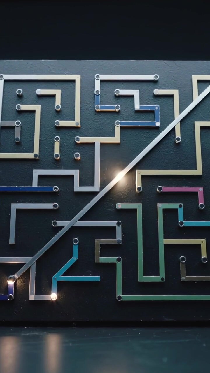 Vertical video: Moving bright dot up diagonal bar on display as lower bulbs lighting