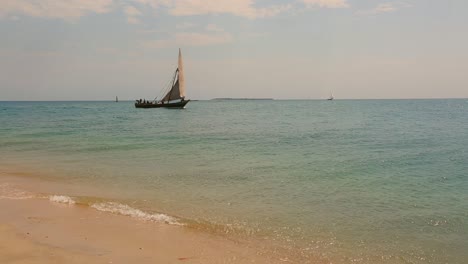 a dow passing by in stonetown, zanzibar