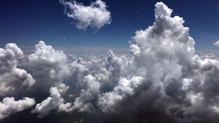 Aerial View of Fluffy White Cumulus Clouds in Blue Sky
