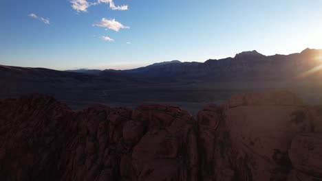 aerial-sunset-landscape-of-red-rock-formation-in-Las-Vegas,-natural-red-rock-canyon-drone-close-up