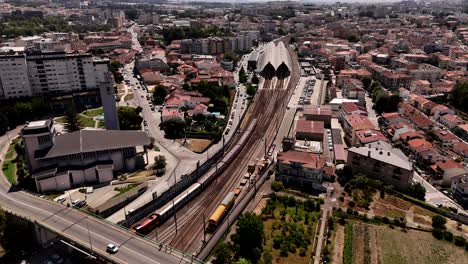 aerial view of a city with train station and church