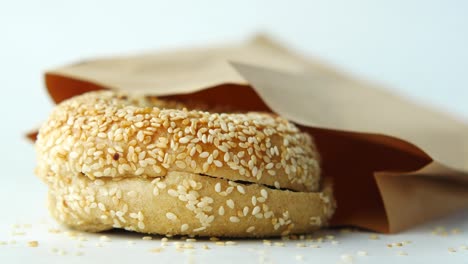 bagel in brown paper bag