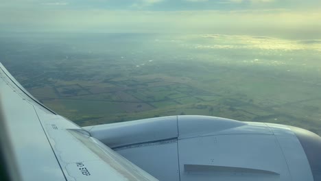passenger pov onboard airplane banking over durazno nature reserve and water reservoir on approach to buenos aires ministro pistarini international airport