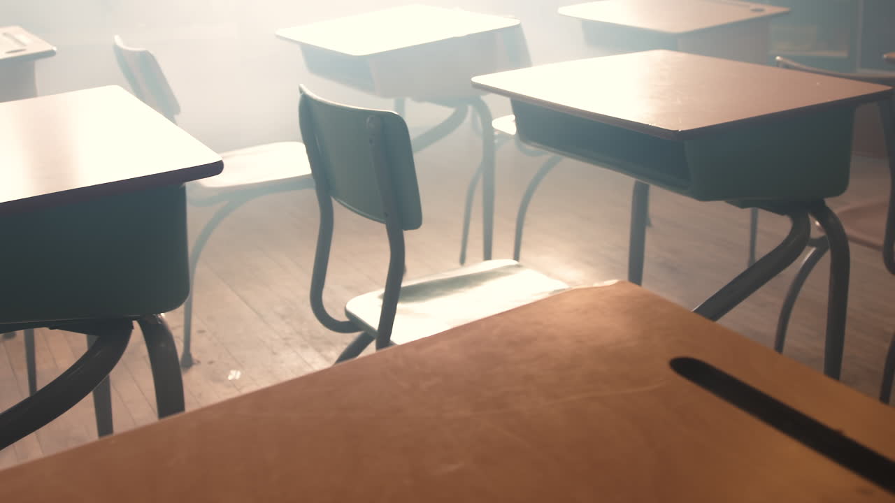 Classroom zoom and dolly shot through the desks