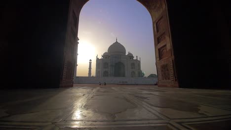 approaching the taj mahal through an archway