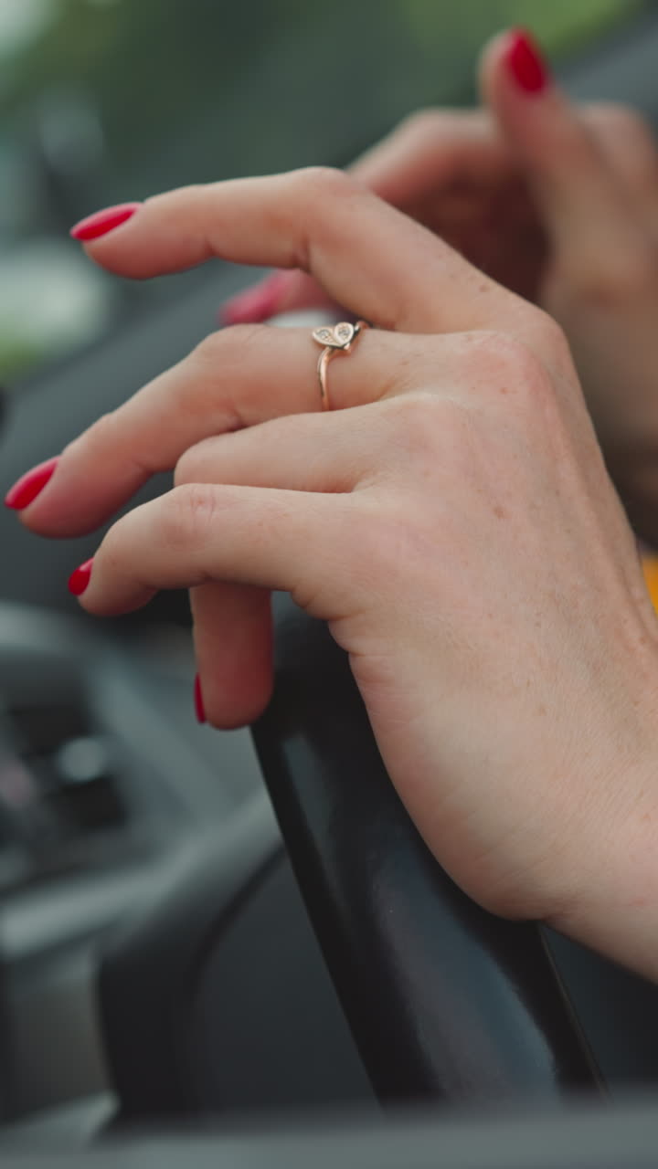 Angry woman hits steering wheel of personal automobile with hands against biker passing by. Impatient driver stuck in traffic jam closeup slow motion