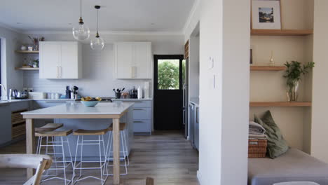 a modern kitchen blends seamlessly with a cozy living area