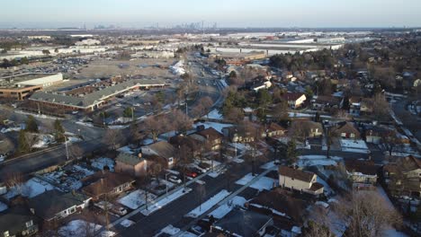 Winter-drone-static-aerial-view-over-houses-in-a-residential-area