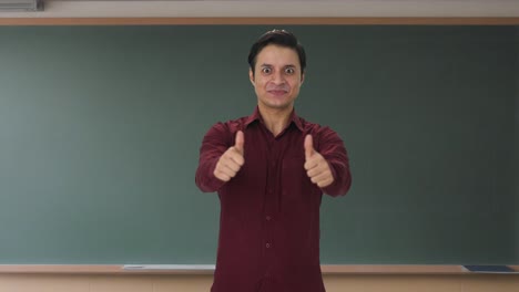 Happy-Indian-teacher-showing-thumbs-up