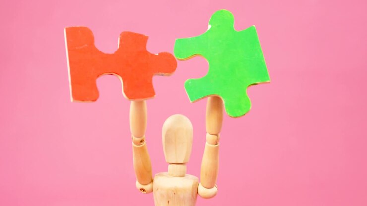 Figurine holding jigsaw puzzle