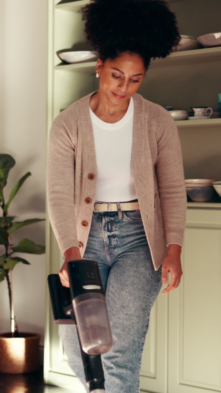 Woman vacuuming at home