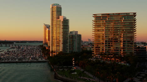 miami sunset cityscape: stunning aerial view of skyscrapers, marina, and park