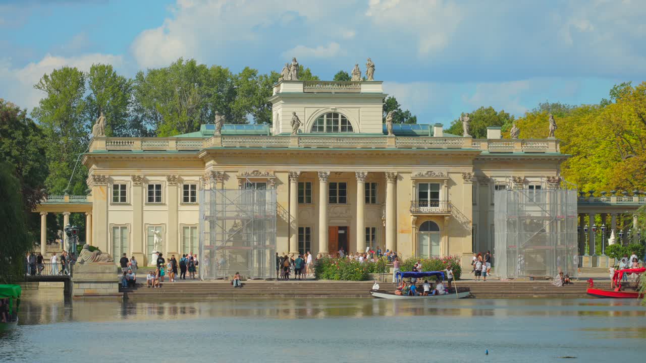 Construction work, building facade, people sightseeing, boat transport
