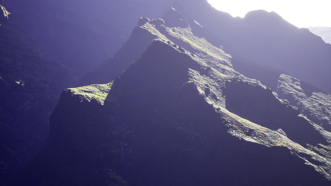 Majestic mountain landscape with dramatic lighting and rugged terrain in nature