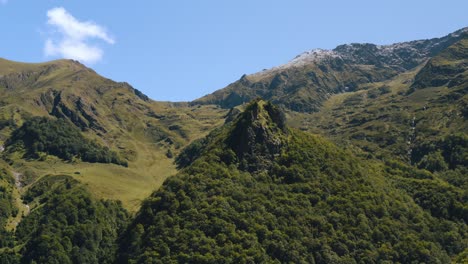 aerial view of mountains in ariège pyrénées, a drone flying ahead over the peaks