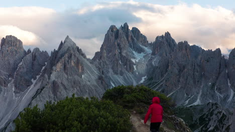 man races to mountain ledge, reveals beautiful dolomites in italy