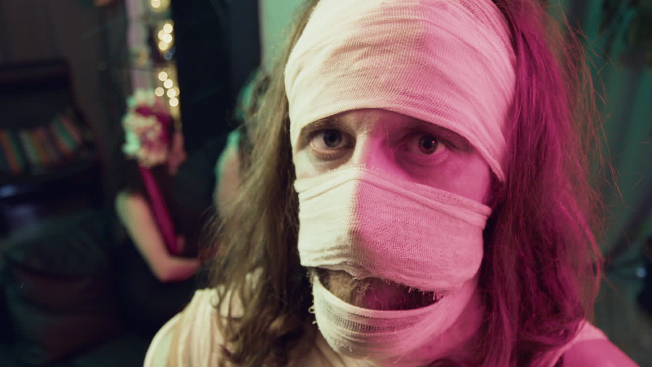 Man looking at camera at a Halloween party