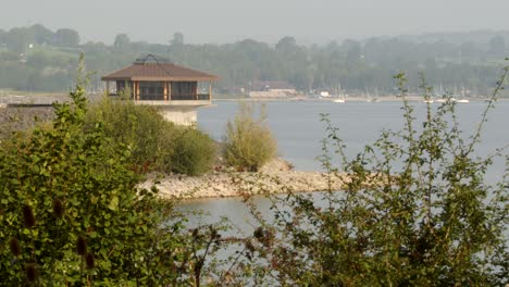 wide-shot-of-Carsington-Water-Carsington-Water-Valve-Tower,-Draw-Off-Tower-from-Millfields-car-park