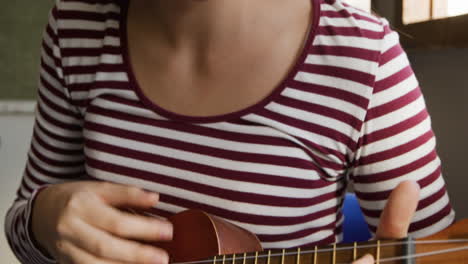 teenage musicians rehearsing