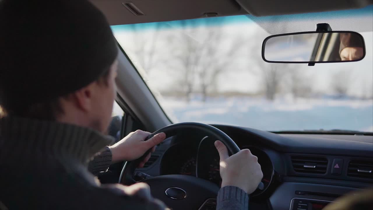 Man Driving a Car in Winter