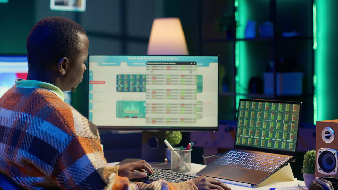 Man Analyzing Stock Market Data on Computer