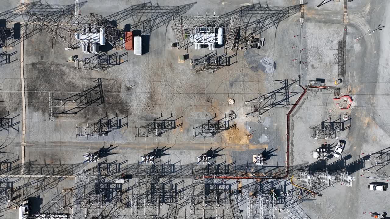 Aerial top down flyover electrical substation in suburb of american town