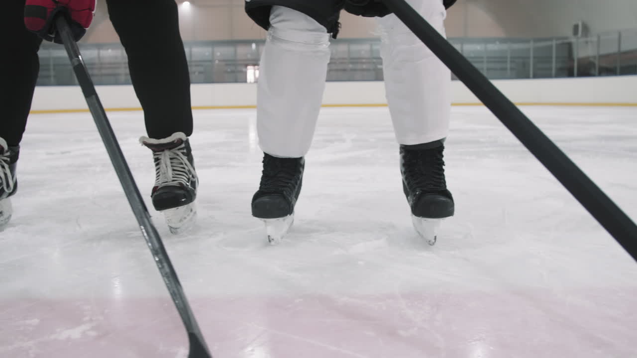 Hockey Players Legs On Ice Rink