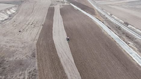 Red-tractor-plowing-the-field