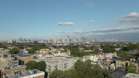 ascending aerial drone shot of nyc skyline, horizon during golden hour shot in jersey city new jersey