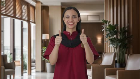 Happy-Indian-female-housekeeper-showing-thumbs-up