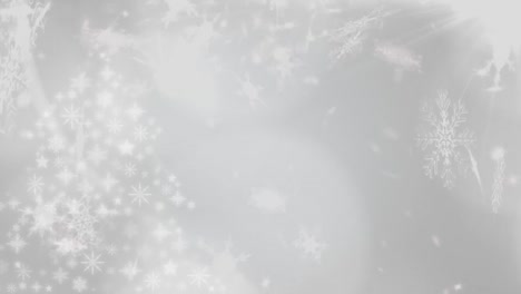 snowflakes falling against white background