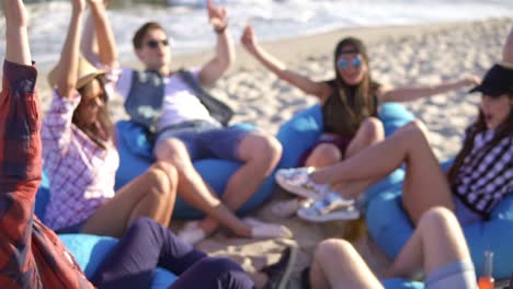 Close-Up-view-of-many-hands-united-together-and-raised-up.-Teamwork-and-friendship-concept.-Group-of-friends-sitting-on