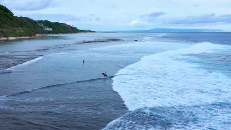 Gunung-Payung-Beach-With-Tourists-In-Bali,-Indonesia---drone-shot