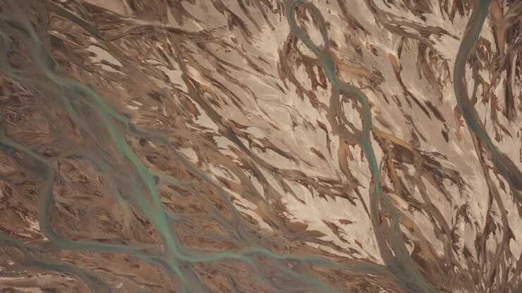Top-down aerial view of river estuary in Landmannalaugar, creating abstract patterns