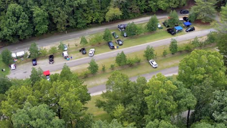 flying over a parking lot at an event