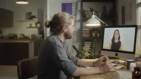 Man Taking Online Class in Evening at Home