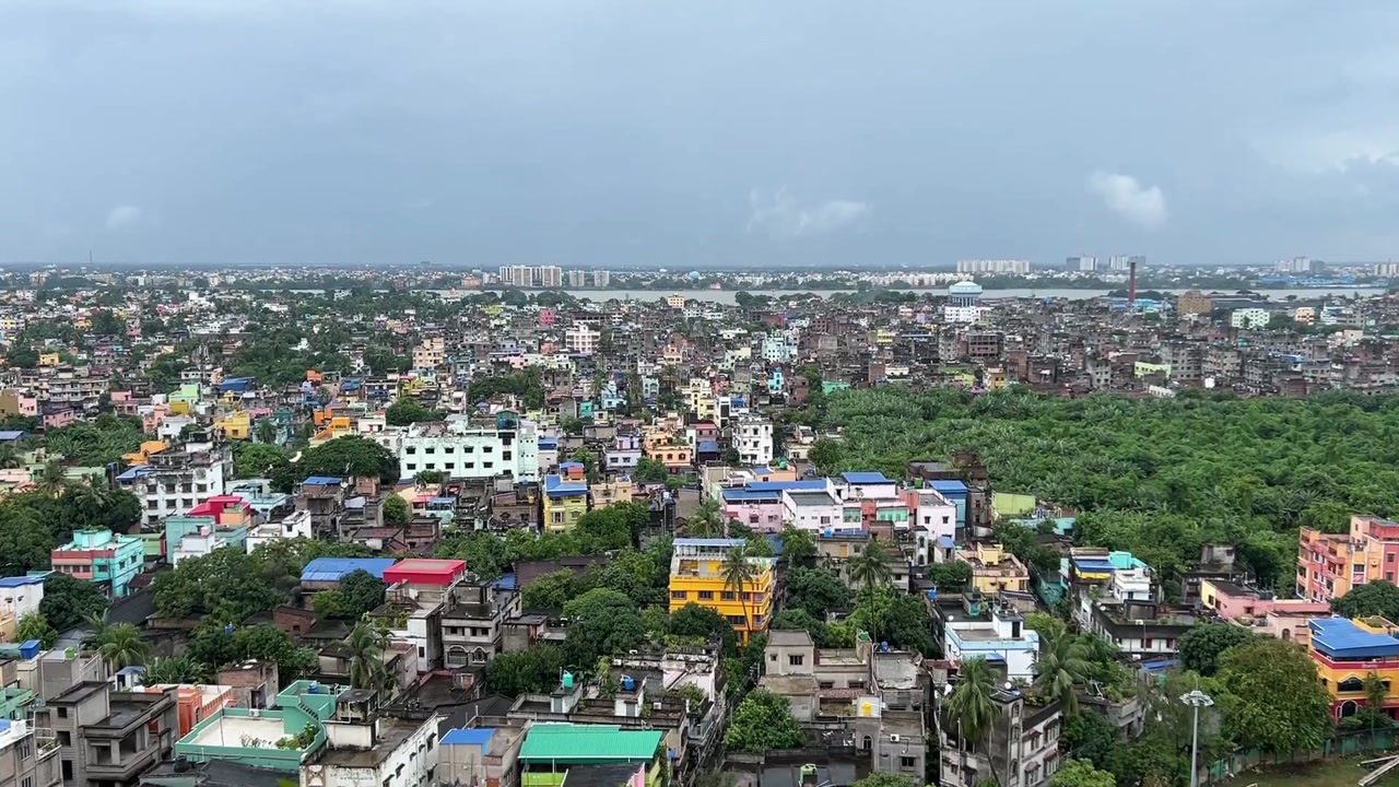 Aerial shot of urban Kolkata with river Hoogly at a distant