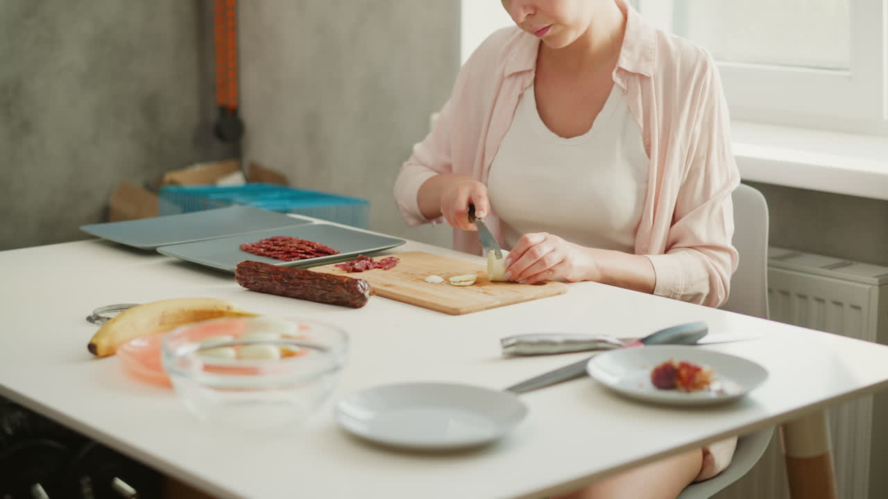 Woman preparing food at a table