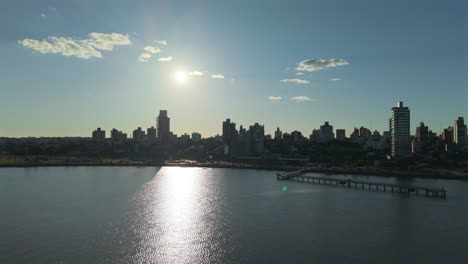 drone view of posadas coastline city of misiones, argentina sunset landscape, downtown, water reflection