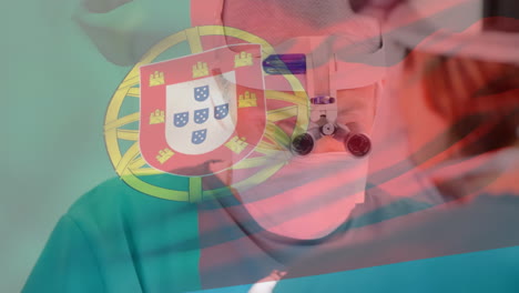 animation of flag of portugal waving over surgeons in operating theatre