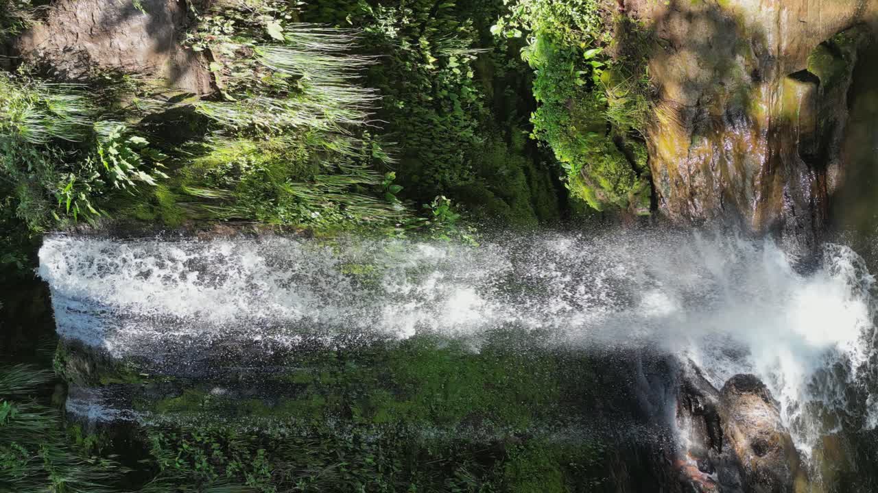 Vertical format: Picturesque Los Vencejos waterfall in Bolivia jungle