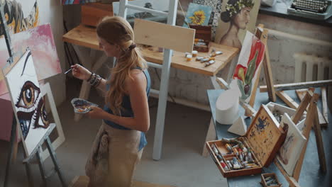 woman painting in art studio