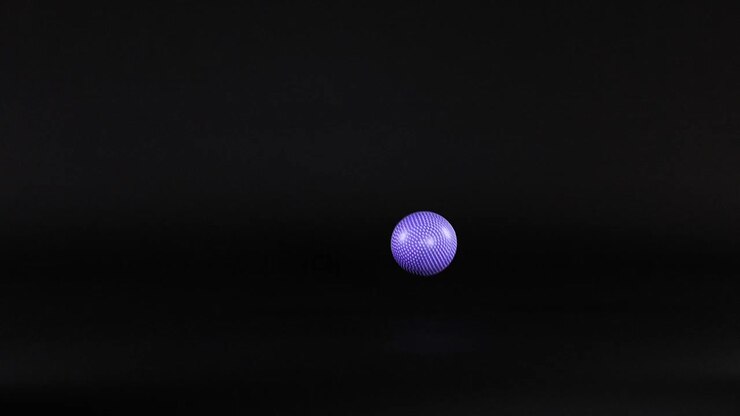 A purple ball moves across a dark background